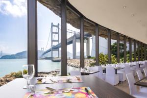 a dining room with a view of the golden gate bridge at Noah’s Ark Hotel & Resort in Hong Kong