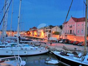 a group of boats docked in a marina at night at Apartman Lorena in Stari Grad