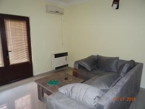 a living room with a couch and a coffee table at LN'S APARTMENT in Borjomi +2 photos