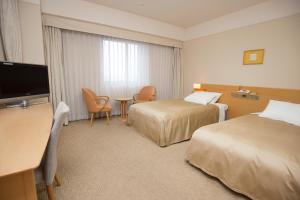 Postel nebo postele na pokoji v ubytování Hotel Lake View Mito + 20 fotografií