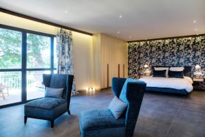 Llit o llits en una habitació de Chambres d'hôtes Domaine de Nazère