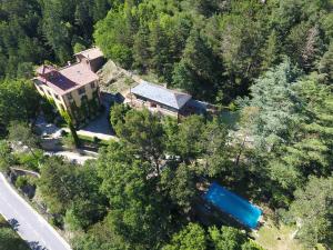 an aerial view of a large house in the forest at Els Apartaments del bosc in Ribes de Freser