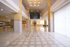 a lobby of a hotel with a tile floor at Hotel Lake View Mito in Mito