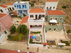 an aerial view of a house with an umbrella at Filoxenia Apartments in Halki