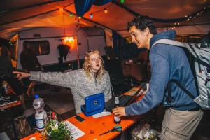 a man and a woman standing in a tent at Festanation Oktoberfest Camp #1 in Munich