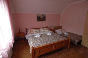 Posteľ alebo postele v izbe v ubytovaní Plitvice Rooms Family Glumac