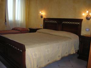 Posteľ alebo postele v izbe v ubytovaní Agriturismo Colombarola