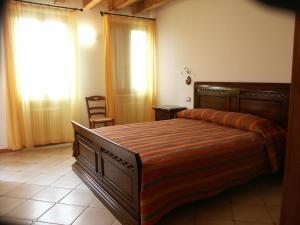 Posteľ alebo postele v izbe v ubytovaní Agriturismo Colombarola