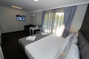 Krevet ili kreveti u jedinici u okviru objekta Hotel Alexandar II