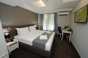 Krevet ili kreveti u jedinici u okviru objekta Hotel Alexandar II