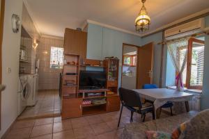 a living room with a table and a dining room at Anastasia 3 in Veli Lošinj
