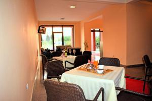 a dining room with two tables and chairs at Apartments Contessa in Ulcinj