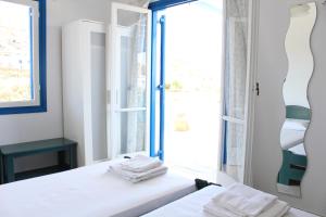 Postel nebo postele na pokoji v ubytování Mare Blue Ios
