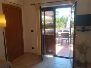 a room with a sliding glass door leading to a patio at Isabel in Crotone