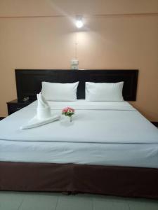 Postel nebo postele na pokoji v ubytování Centerpoint Hotel