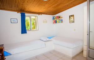 A bed or beds in a room at Haus Manya in Lassy