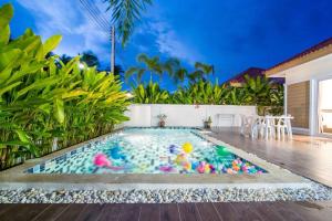 a swimming pool with toys in it in a villa at The Legacy Huahin Pool Villa in Hua Hin