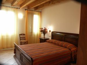 Posteľ alebo postele v izbe v ubytovaní Agriturismo Colombarola