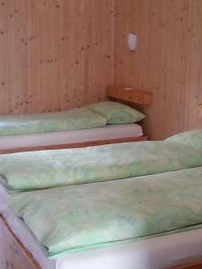 Rúm í herbergi á Familienhotel Campagna