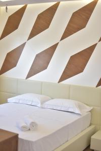Postelja oz. postelje v sobi nastanitve Airen Hotel Velipoje