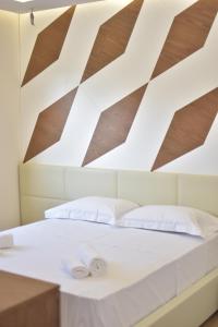 Postelja oz. postelje v sobi nastanitve Airen Hotel Velipoje