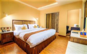 En eller flere senger på et rom på Divinity by Audra Hotels