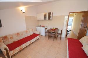 a living room with a couch and a table at Apartmani Prcanj in Kotor