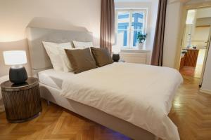 Posteľ alebo postele v izbe v ubytovaní U Kapra Apartments