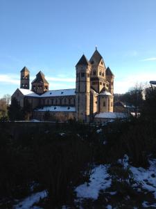 an old building with snow on the ground at Gaestehaus Klaus in Mendig
