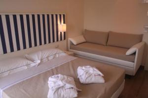 A bed or beds in a room at Mini Hotel