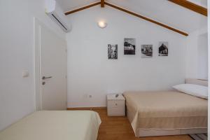 Postel nebo postele na pokoji v ubytování Apartman Mare