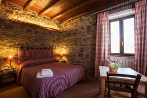 A bed or beds in a room at I Casali della Parata
