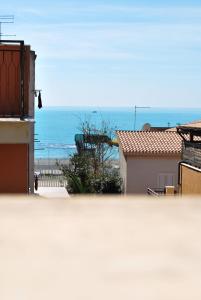 a view of the ocean from the roof of a house at B&B Mare e Templi in Agrigento