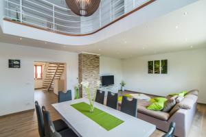 a living room with a table and a couch at Milohanic Luxury Apartments in Poreč