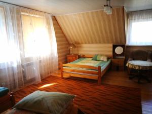 Una cama o camas en una habitación de Agrowczasy u Mirusi