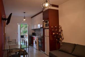 a kitchen and living room with a couch and a table at Casa Pereira in Geres