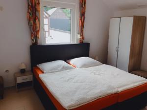 Postel nebo postele na pokoji v ubytování Eifelhof Weina