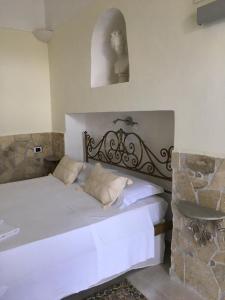 En eller flere senger på et rom på Tenuta Valle Della Corte
