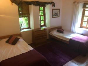 Postel nebo postele na pokoji v ubytování Fig Garden Cottages + 30 fotografií