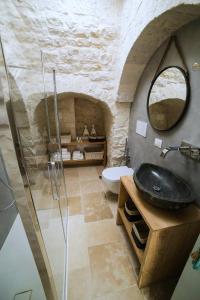 Koupelna v ubytování Hermanas Relais - trulli luxury