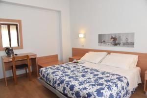 Uma cama ou camas num quarto em Albergo La Rosetta