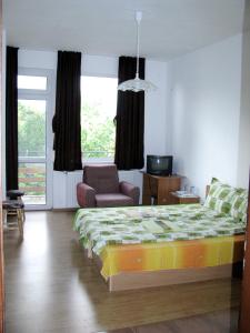 Ένα ή περισσότερα κρεβάτια σε δωμάτιο στο Guest House Familia