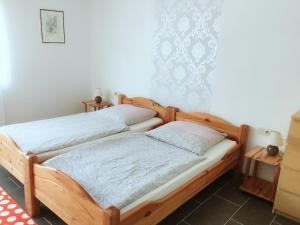 Postel nebo postele na pokoji v ubytování Eifelhof Weina