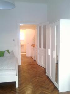 Łóżko lub łóżka w pokoju w obiekcie City-Apartments Langegger