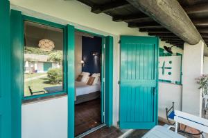 Oustau Camarguen Hôtel & Spa客房内的一张或多张床位