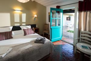 Oustau Camarguen Hôtel & Spa客房内的一张或多张床位