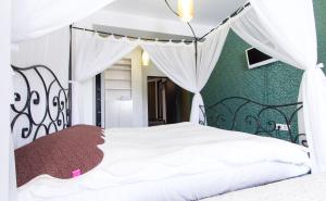 Hotel Jolie Apartments 객실 침대