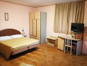 En eller flere senger på et rom på Hotel Ristorante Farese