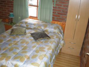 Posteľ alebo postele v izbe v ubytovaní Cabañas Tunquelen