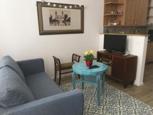 Televízia a/alebo spoločenská miestnosť v ubytovaní M37 Apartman